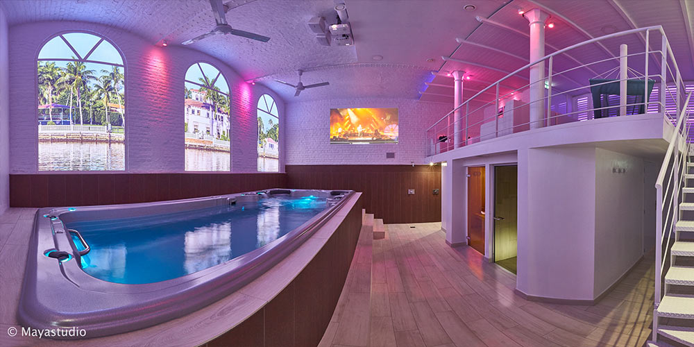Intérieur décoré ambiance Miami avec un spa de nage encastré